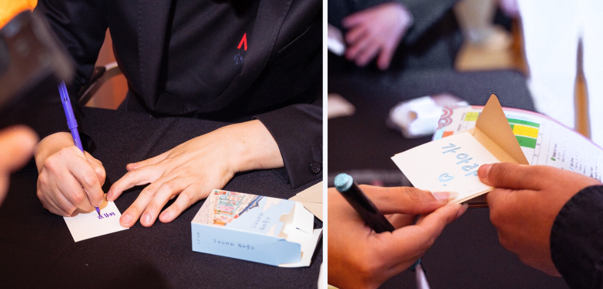 종이에 글을 쓰고있는 사람의 손